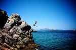 Annie jumping in Hydra, Greece