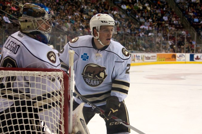 Hershey Bears' Nate Schmidt and Goaltender David Leggio vs Syracuse Crunch 18 December 2013. (Annie Erling Gofus/Olympus Athletics)