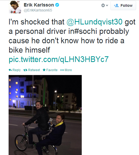 Henrik Lundqvist hitches a ride on the back of a bike in Sochi. 
